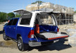 4x4 pickup truck fitted with hard top canopy and chequer sliding bed tray
