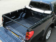 Fixes to the truck’s bed using an aluminium frame