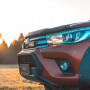 Triple-R 750 Spotlights fitted to upper grille on Toyota Hilux model