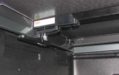 Hidden clamps on the tonneau cover for easy installation