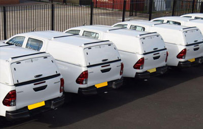 Fleet of Toyota Hiluxs fitted with Pro//Top Low Roof Tradesman Canopies