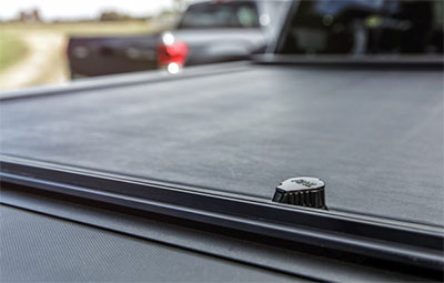 Close up of the key slot cover on the Roll-N-Lock tonneau cover