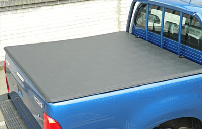 Soft tri folding load bed cover on a Toyota Hilux